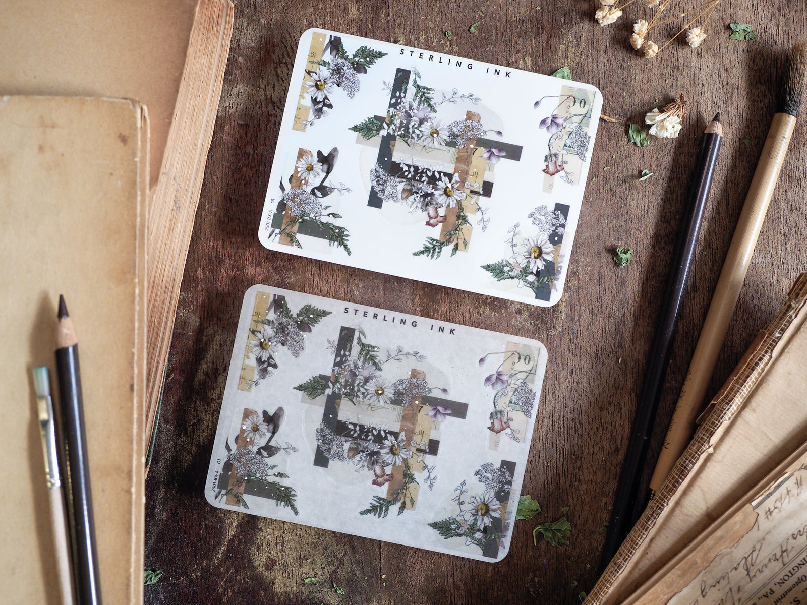 Botanical corner stickers featuring elegant seasonal arrangements of soft white blossoms and dark green foliage on a vintage cream background.
