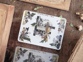 Elegant botanical corner stickers featuring detailed clusters of white and dark florals, lush greenery, and antique silver foil accents for scrapbooking.