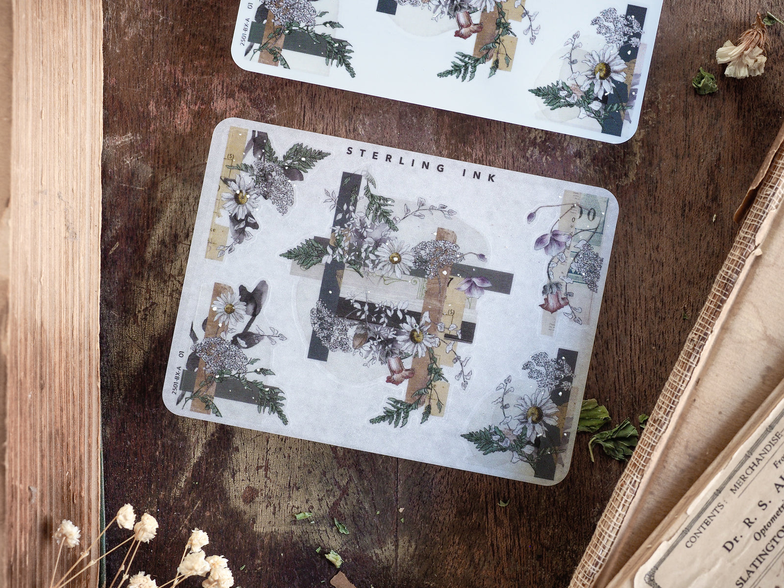 Decorative sticker sheet featuring a vintage botanical pattern with silver foil, lush greenery, and delicate floral arrangements perfect for creative journaling or planner accents.