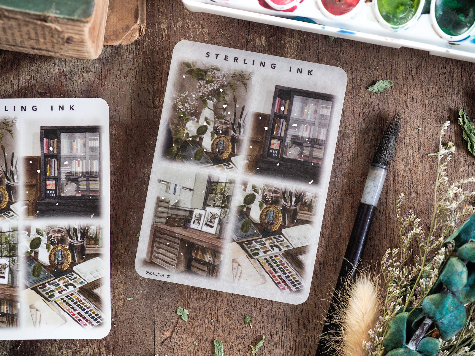 Detailed sheets of vintage illustration stickers featuring still life objects, books, art supplies, and ornate silver foil accents for journaling.