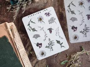 Detailed 'Elements Stickers' sheet featuring black-and-white vintage botanical illustrations of various flowers, foliage, and leaves for January 2025 planning.