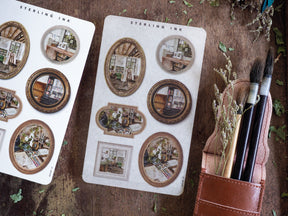 Vintage sticker set featuring multiple ornate, beige-toned picture frames depicting cozy, academic library and interior scenes for journaling.