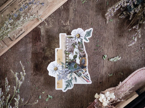 Missouri-shaped die-cut sticker featuring a vibrant spring botanical collage of sunflowers, lush greenery, and delicate white flowers.