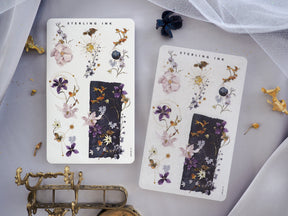 Watercolor floral sticker sets featuring delicate spring blooms, berries, and foliage in soft purples, blues, and creamy tones.