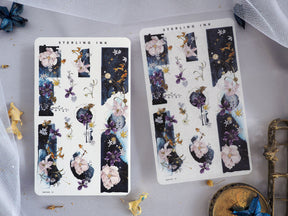 Watercolor floral washi strips featuring delicate pink and purple blossoms, gold accents, and deep blue backgrounds perfect for journaling and scrapbooking.
