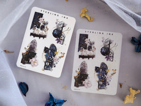 Illustrative sticker sheets featuring January 2024 themes with ornate dark architecture, delicate blush floral arrangements, and detailed vintage cityscape vignettes.