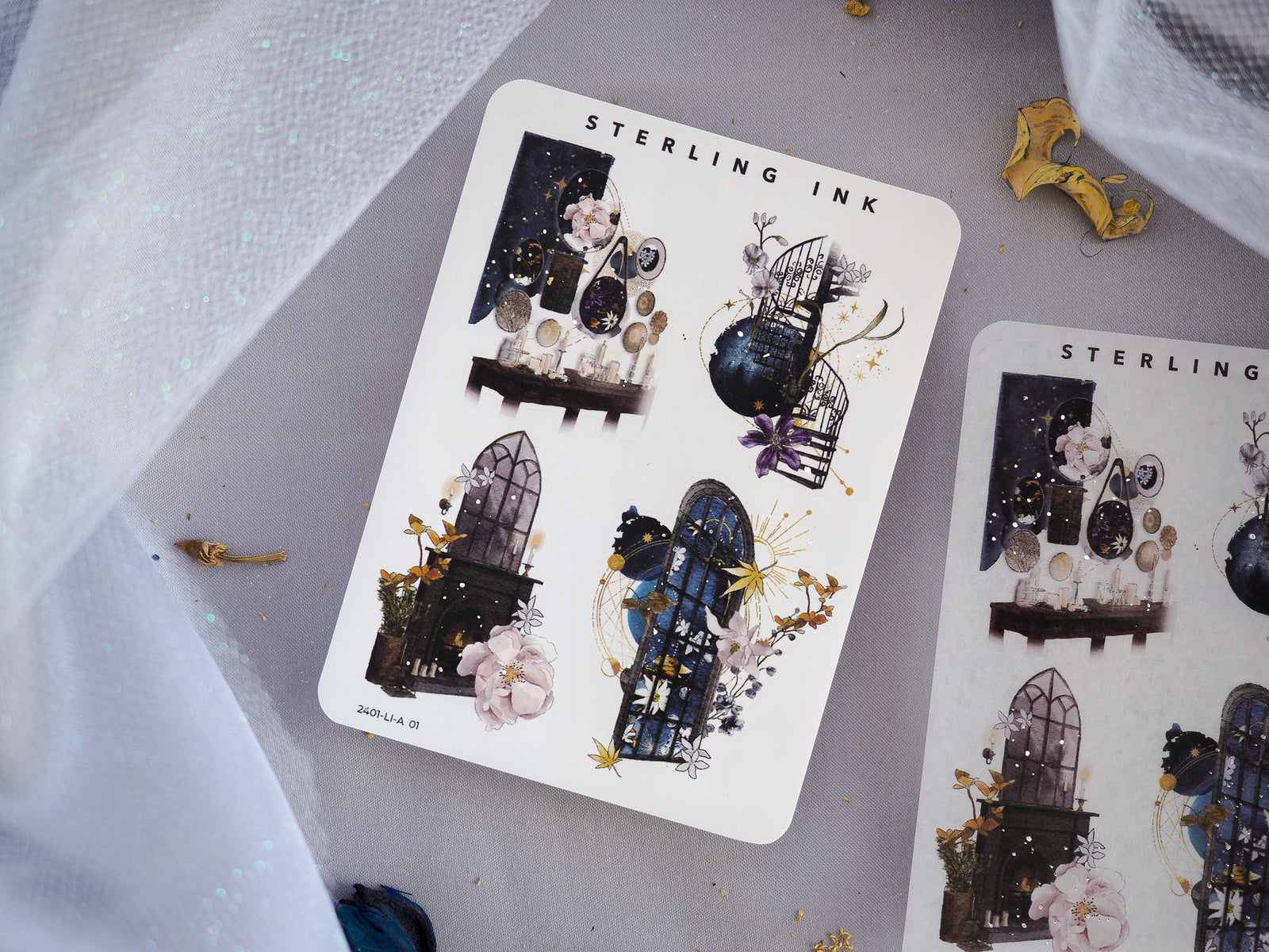 Highly detailed sticker sheets featuring dark, gothic motifs, including ornate windows, floral bouquets, and clockwork elements accented with shimmering silver foil.