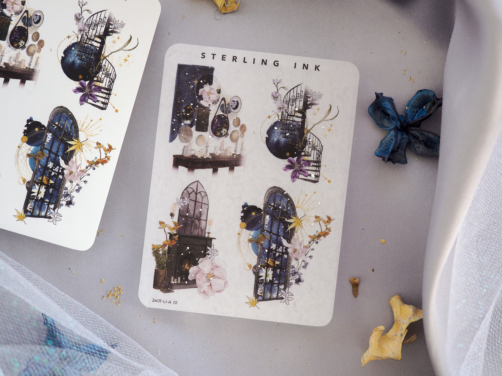 Vintagewear set of decorative icon stickers featuring deep blue gothic architecture, dramatic windows, and ornate floral accents with shimmering foil details.