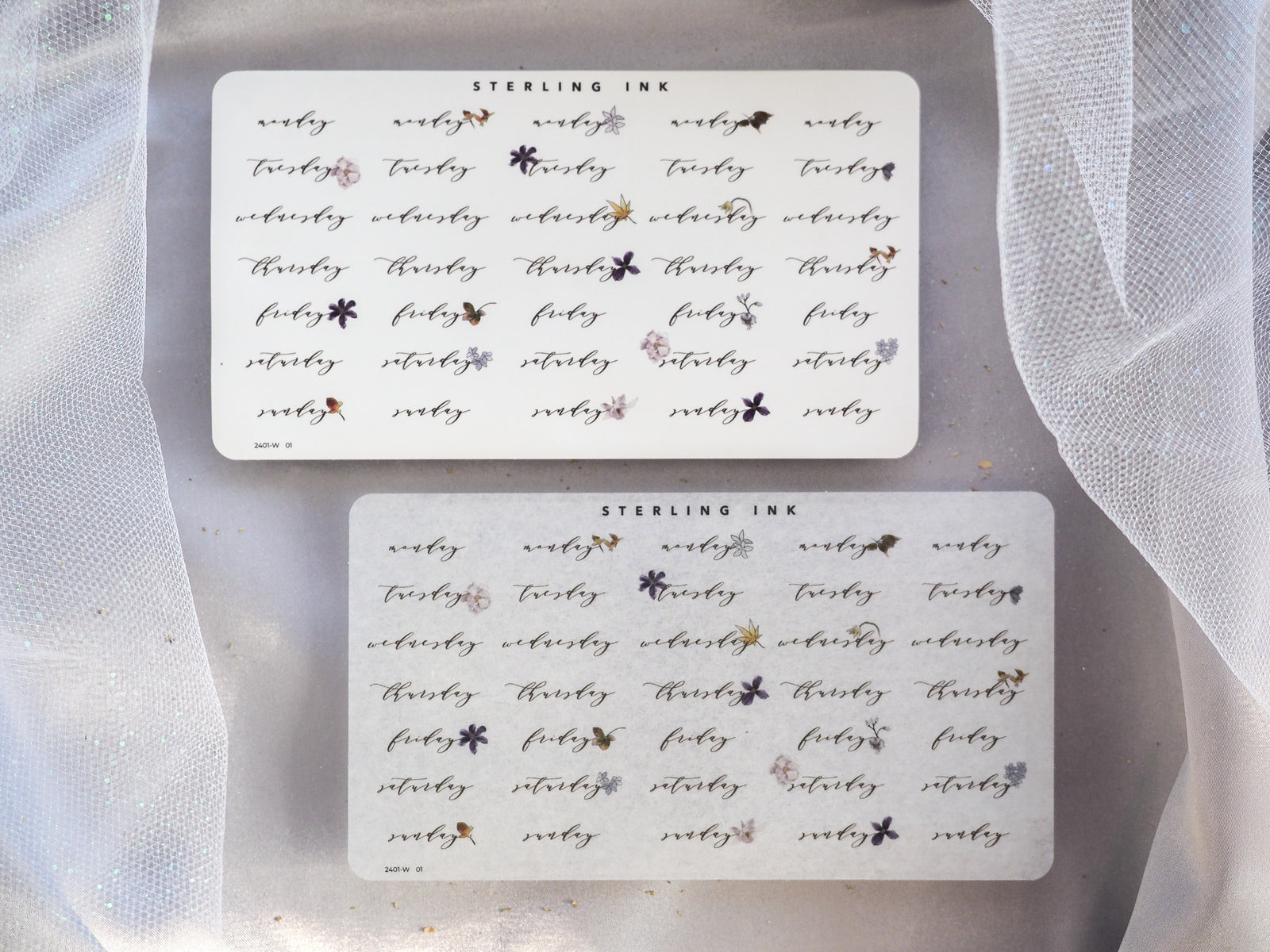Minimalist white sticker sets for January 2024, featuring organized weekday names and delicate scattered floral accents for planners and journals.