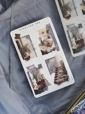 Collage sheet of sepia-toned vintage stickers depicting faded architectural sketches and nostalgic interior room vignettes.