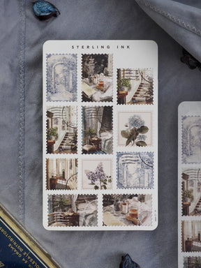 Decorative sheet of vintage "Sterling Ink" stickers featuring antique blue and sepia illustrations of architectural vignettes and botanical sketches.