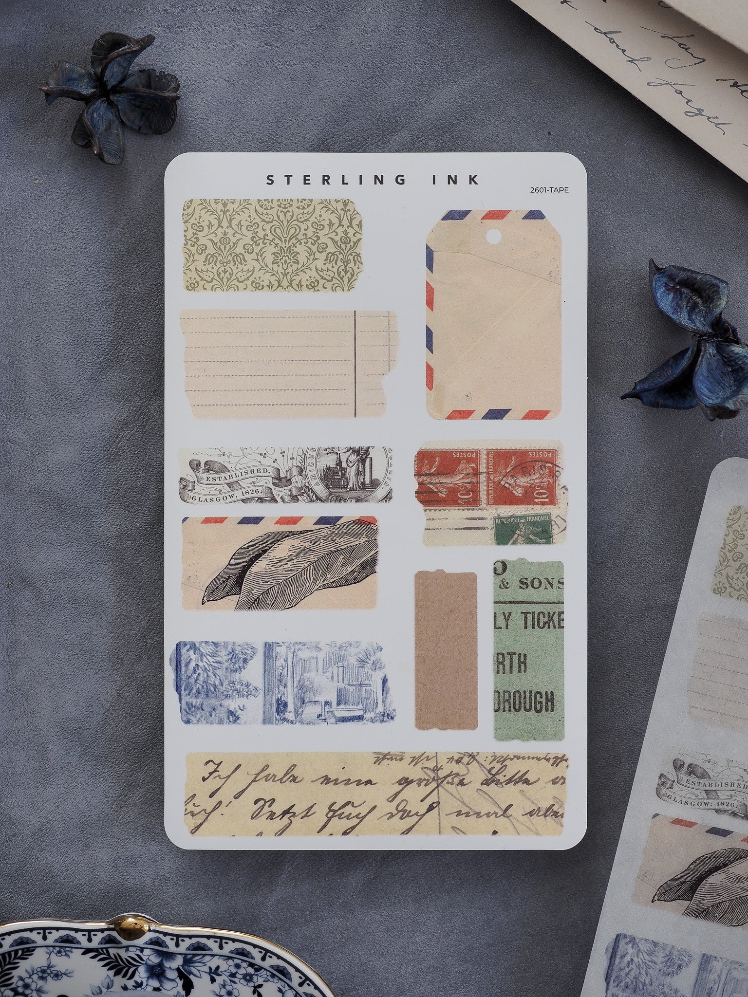 A curated assortment of vintage torn tape stickers featuring floral patterns, blank strips, ticket stubs, and antique ephemera perfect for journaling and scrapbooking.