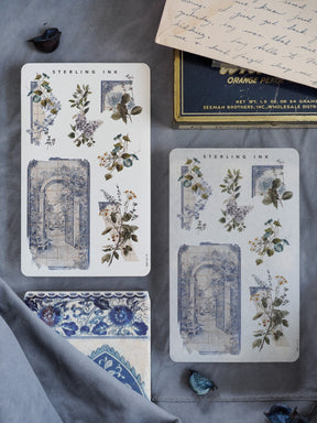 Vintage printable sticker sheets featuring faded blue architectural arches paired with lush, detailed watercolor botanical arrangements.