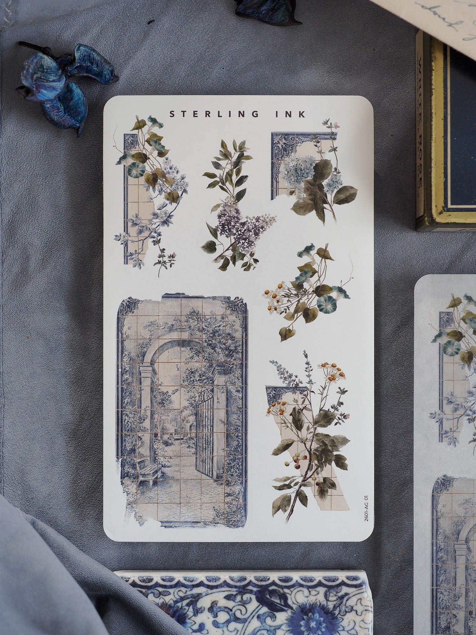 Vintage botanical arrangement stickers featuring delicate sketches of flowers and foliage paired with faded blue architectural doorways.