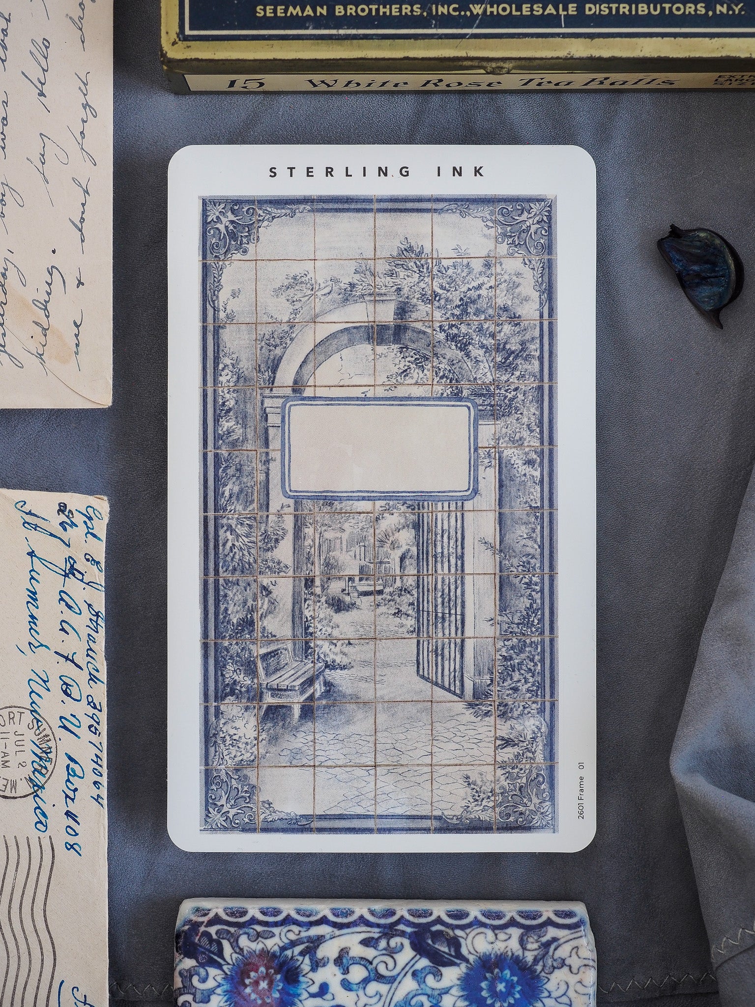 Intricate blue and white Victorian-style frame surrounding an arched portal, richly decorated with detailed floral and architectural motifs.