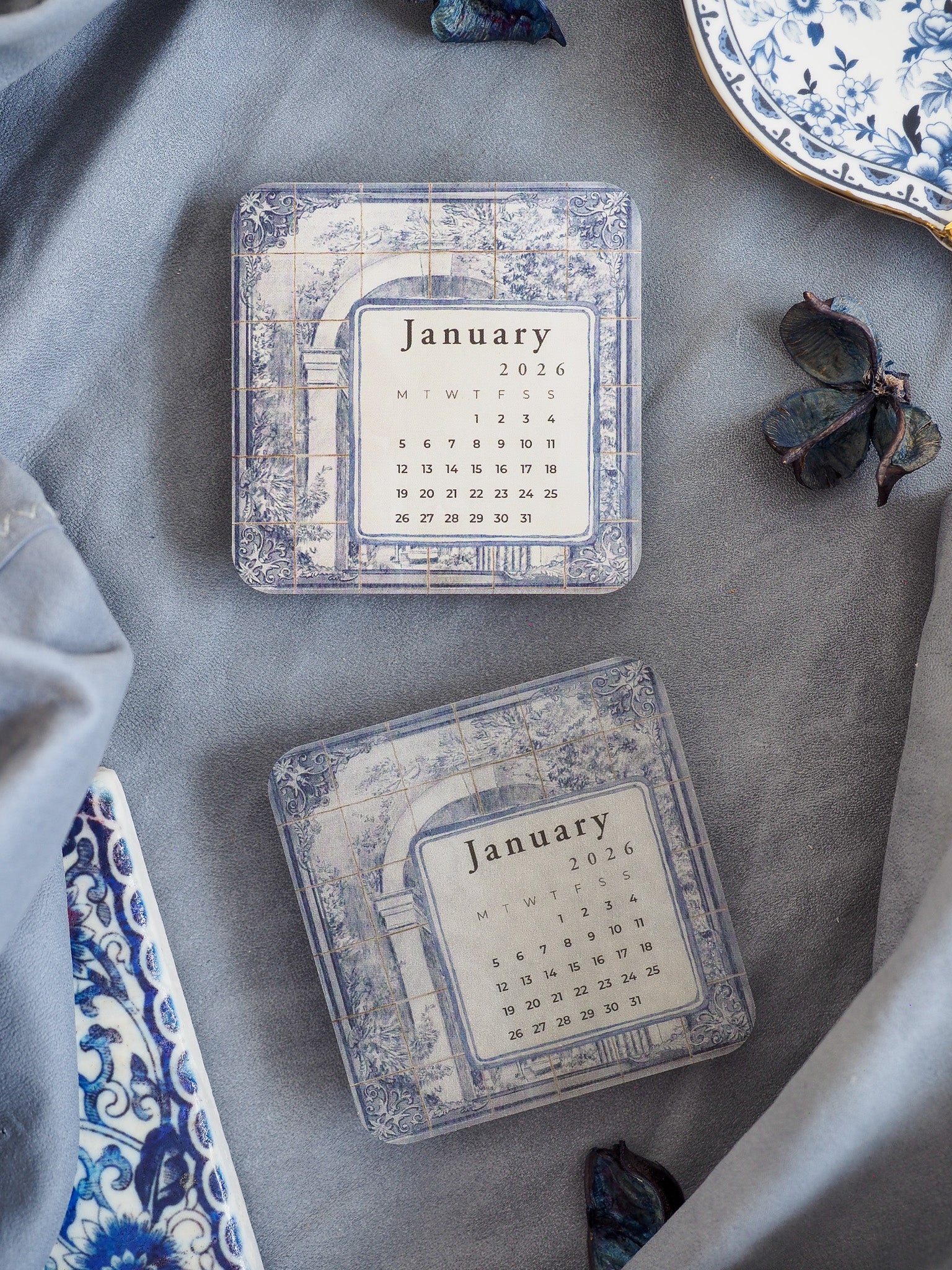 Vintage calendar sticker displaying January 2026, featuring distressed blue and white watercolor tiling and elegant patterned borders.