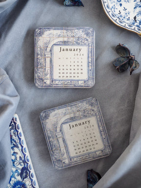 Vintage calendar sticker displaying January 2026, featuring distressed blue and white watercolor tiling and elegant patterned borders.