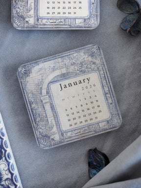 Elegant January 2026 calendar sticker featuring a vintage, distressed tiled grid background with subtle blue, gray, and sepia accents.
