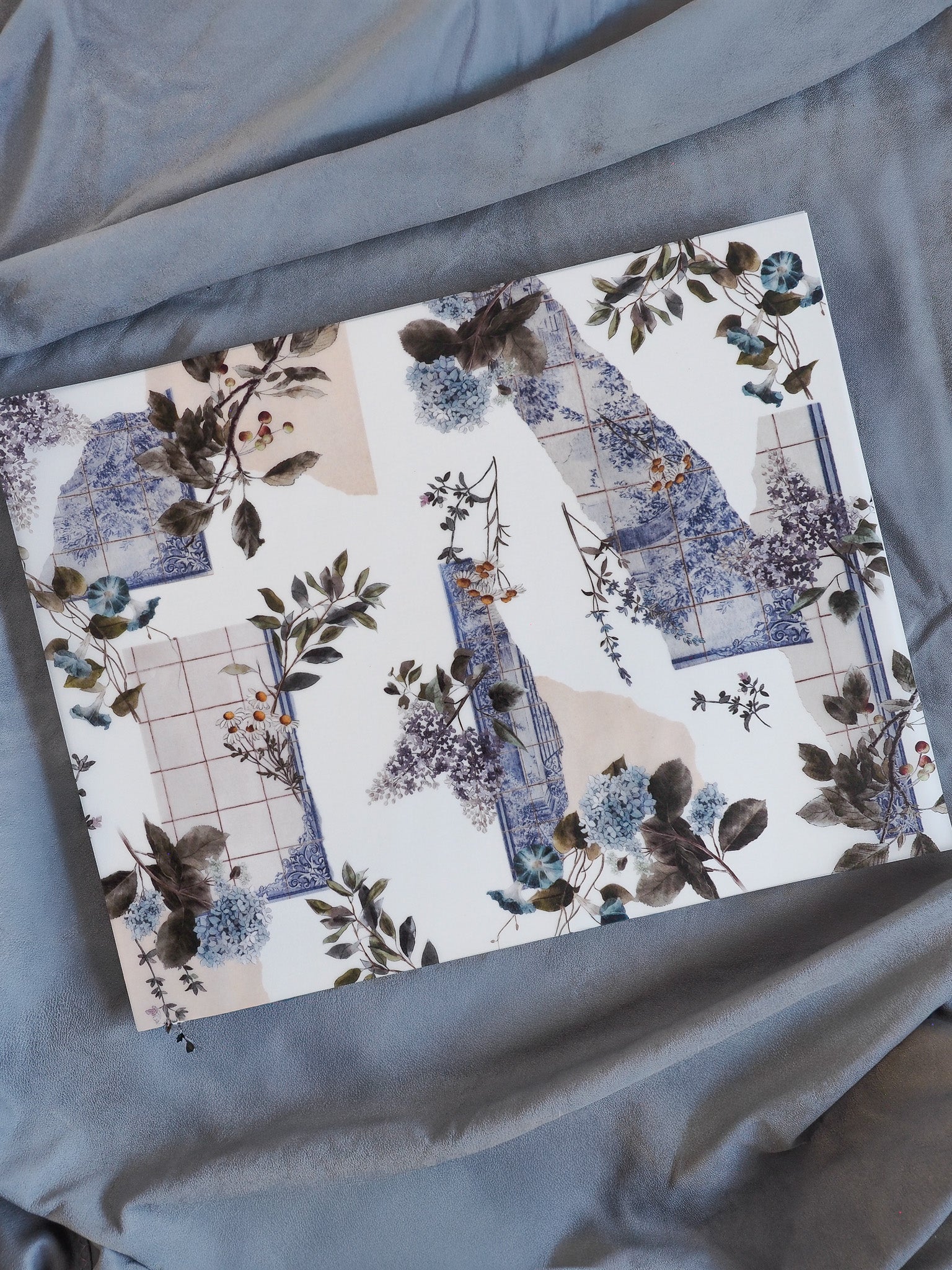 Botanical planner design featuring delicate blue and purple watercolor florals intertwined with structured beige and deep indigo accents.