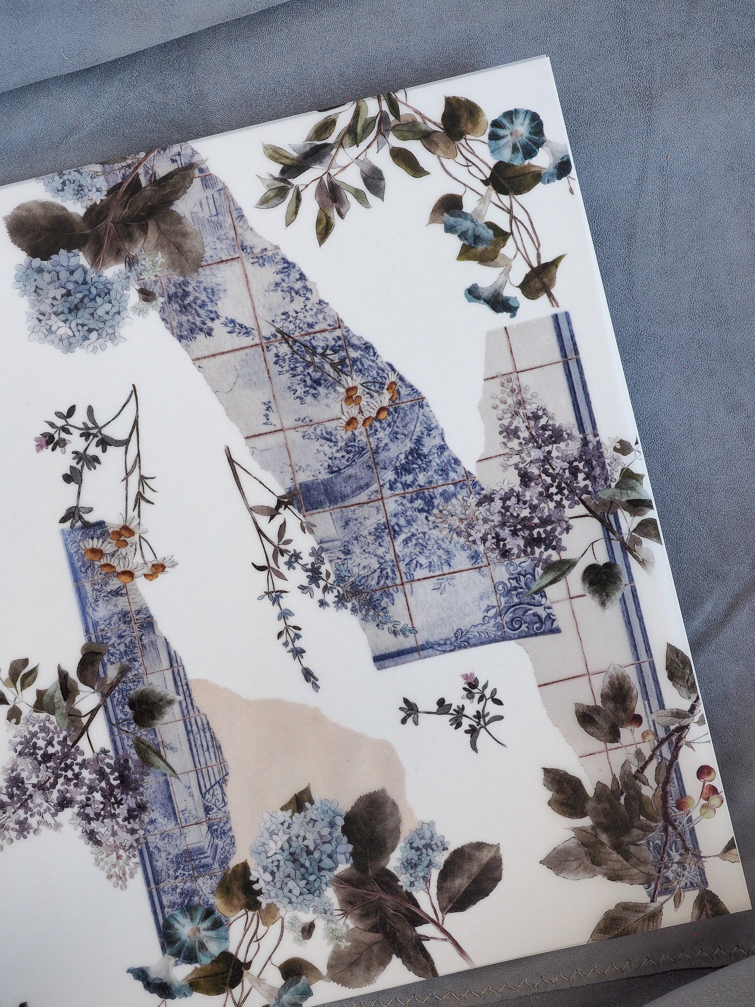 Elegant floral pattern notebook cover featuring watercolor blue and lilac bouquets mixed with antique tiled panels, titled 'Vellum - January 2026'.