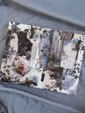 Intricate botanical illustration featuring deep blue and muted brown tones, depicting a romantic, overgrown floral scene set within a vintage architectural frame.