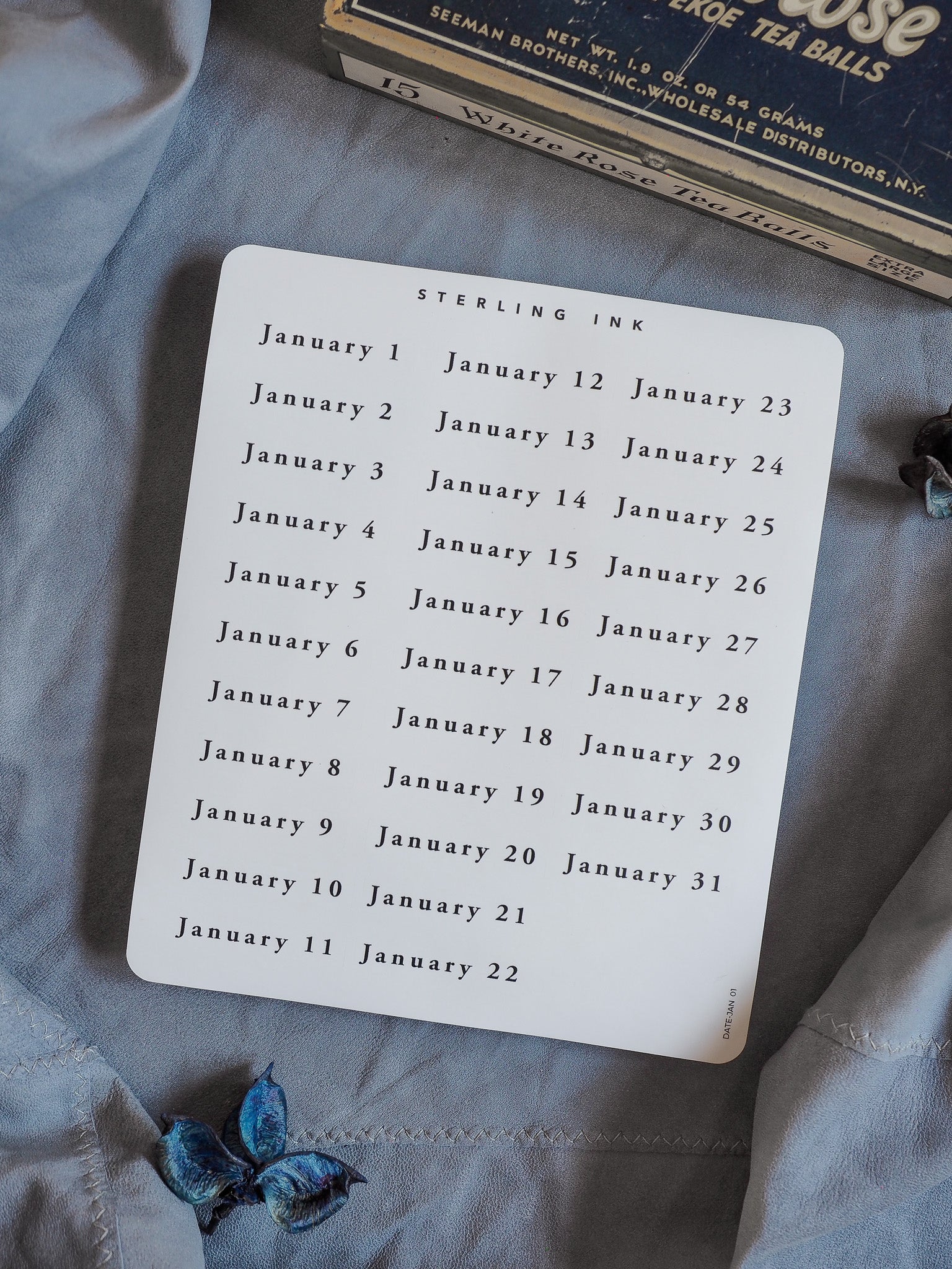 White calendar sticker sheet featuring a printed grid of numbered dates for January, providing an organized planning tool for 2026.