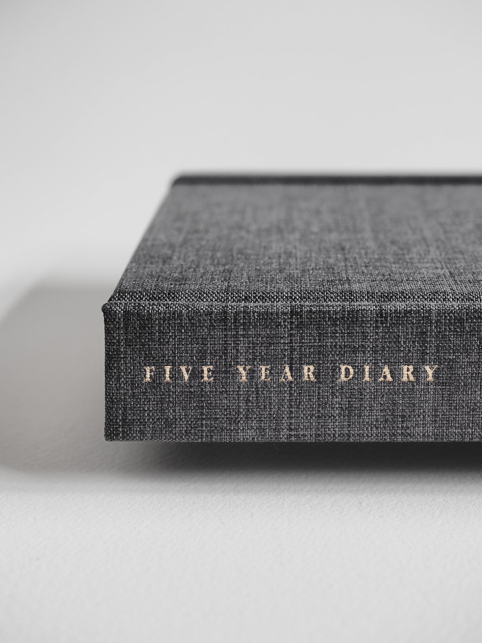 Textured dark gray B6 hardcover diary featuring the embossed title "FIVE YEAR DIARY" centered on the front cover.