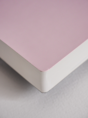 Solid blush pink A5 undated planner notebook, featuring a smooth cover perfect for full-year journaling and daily organization.