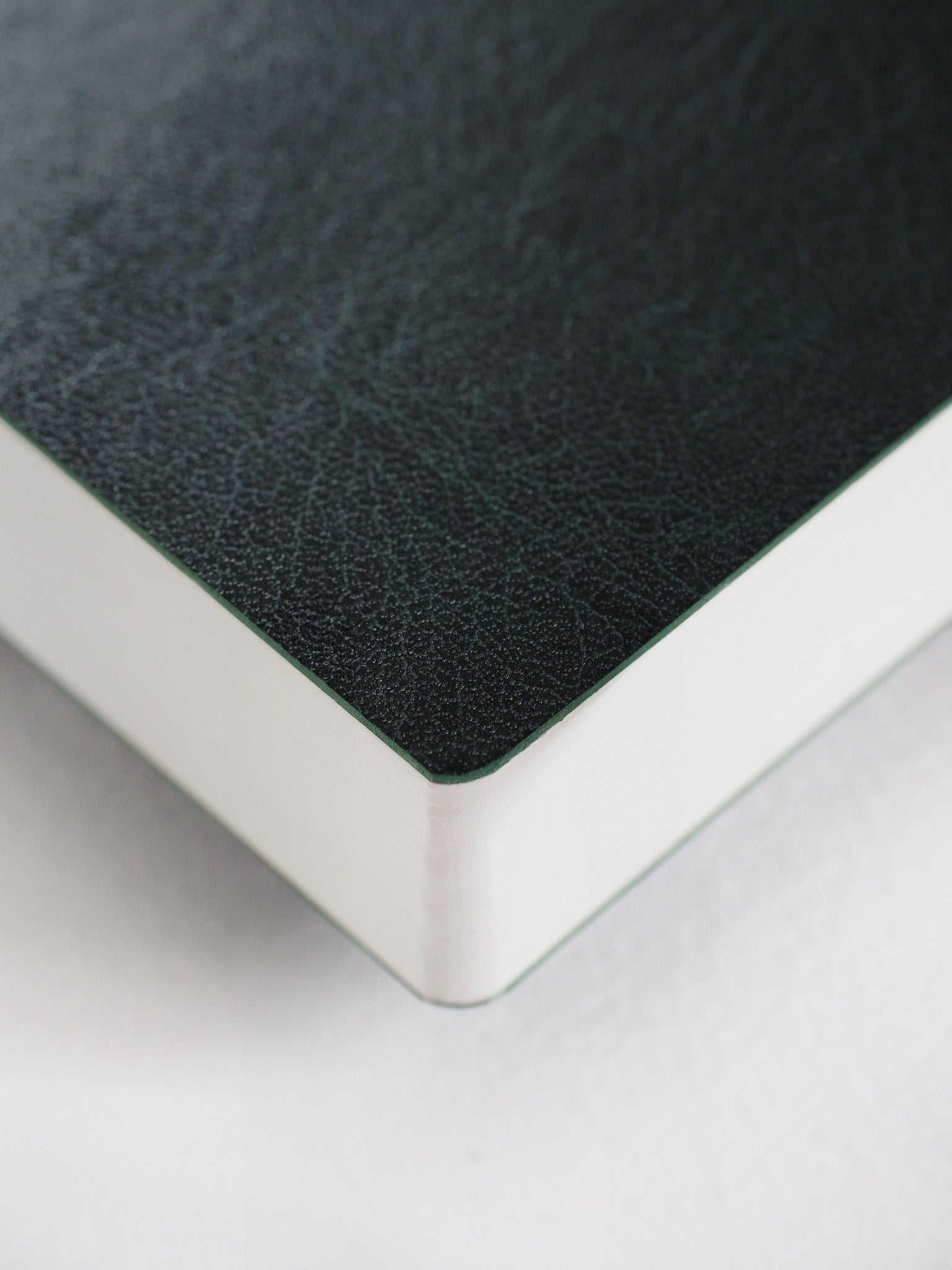 Sleek B6 vertical annual planner featuring a solid matte charcoal cover and clean white binding, perfect for 2026 year organization.