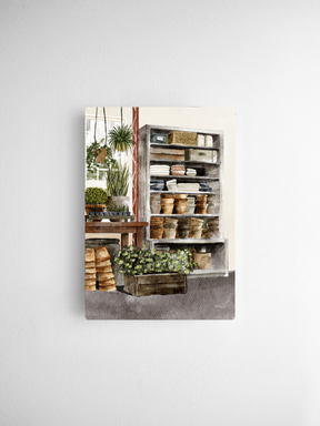Watercolor illustration of a cozy corner featuring stacked decorative objects on open shelving and lush potted green plants.