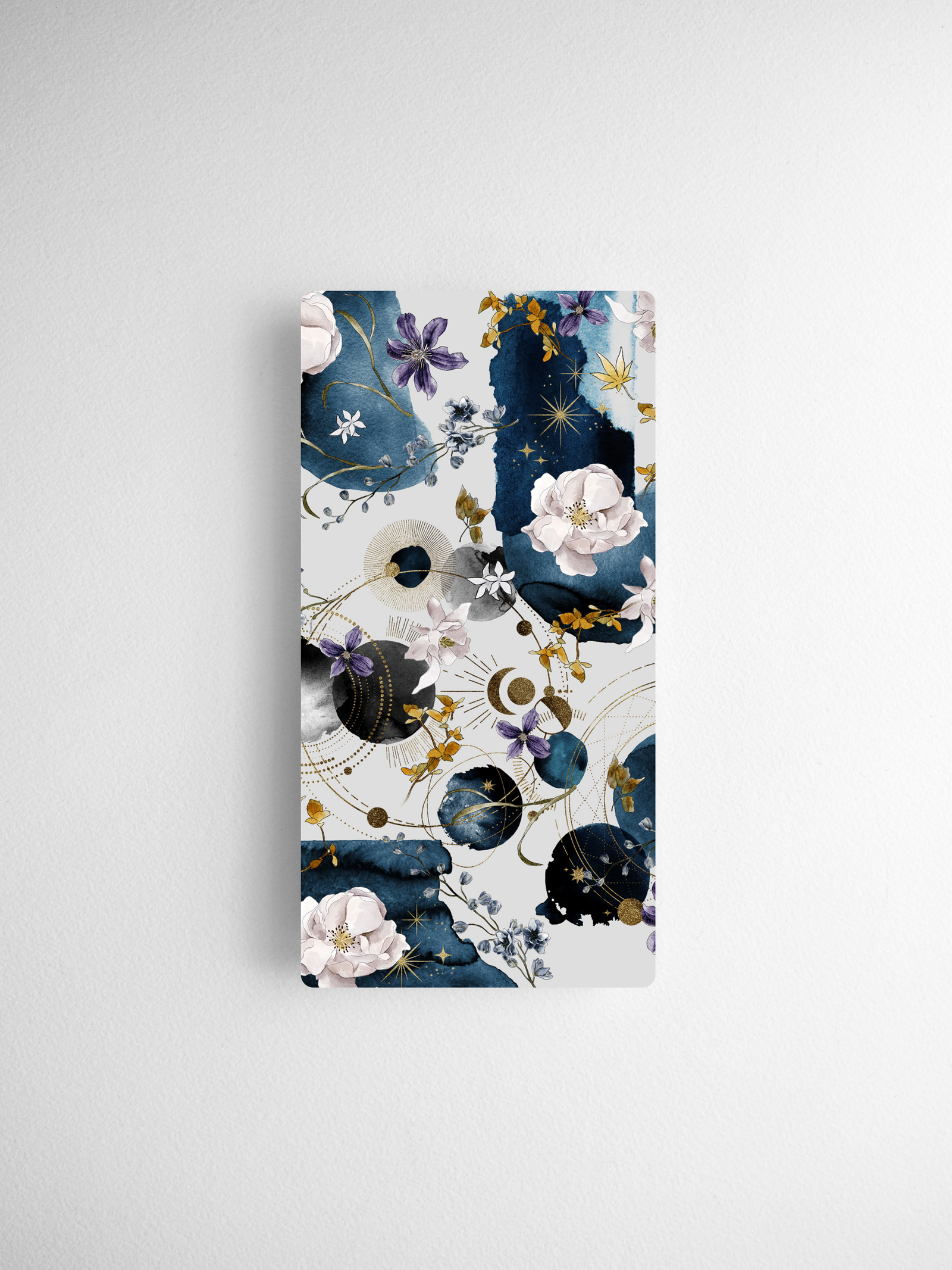 A vertical calendar card featuring a detailed celestial and floral design with deep navy blues, dusty mauves, gold accents, and delicate white botanical illustrations.