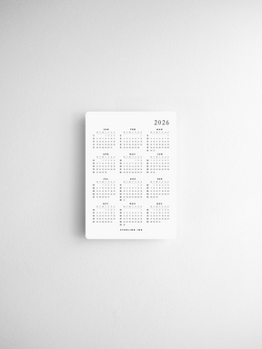 A set of twelve structured monthly calendar cards for 2026, featuring a clean, minimalist black-on-white grid design for easy planning.