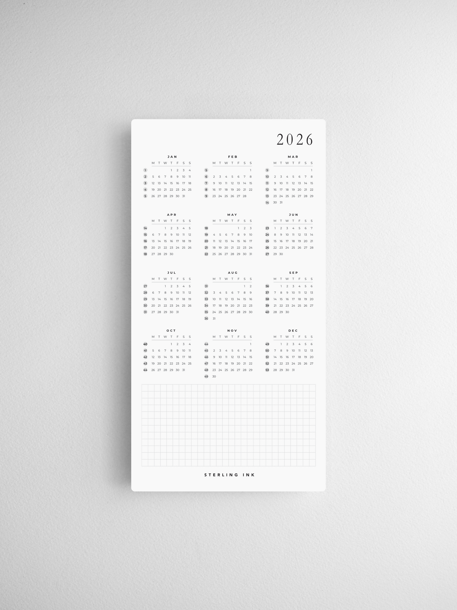 A set of twelve minimalist 2026 calendar cards, printed in black ink, featuring a structured monthly grid layout perfect for comprehensive year-long planning and organization.