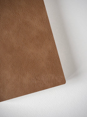 Solid, warm mocha brown grid notebook featuring a richly textured faux leather cover, perfect for standard size planning and journaling.