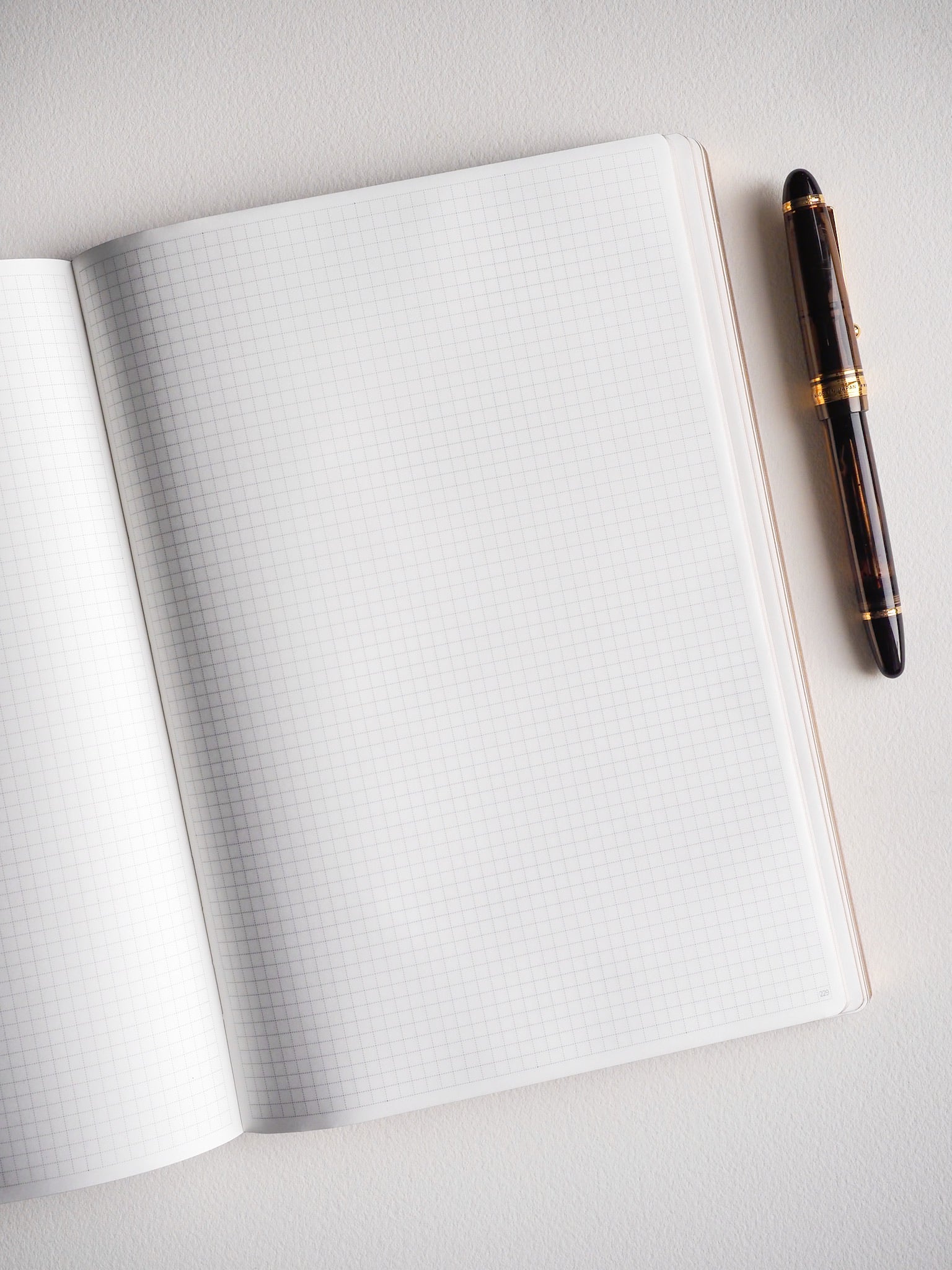 Open B5 notebook featuring 272 pages of precise graph-ruled grid paper, offering a highly structured surface perfect for detailed note-taking, charting, or study planning.