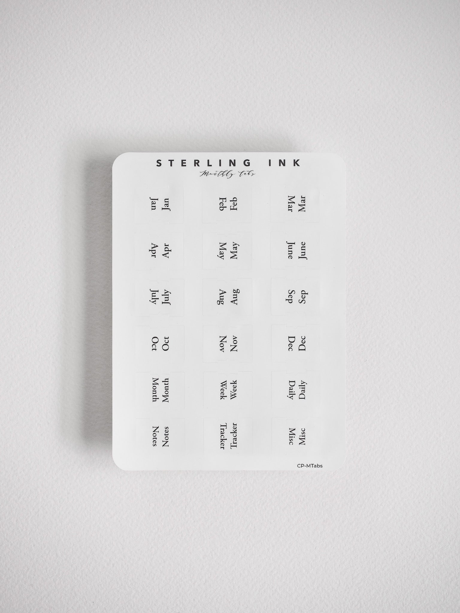 Comprehensive organizational tab sticker sheet featuring monthly markers (January–December) and sections for daily, weekly, and monthly planning, perfect for academic planners and journals.