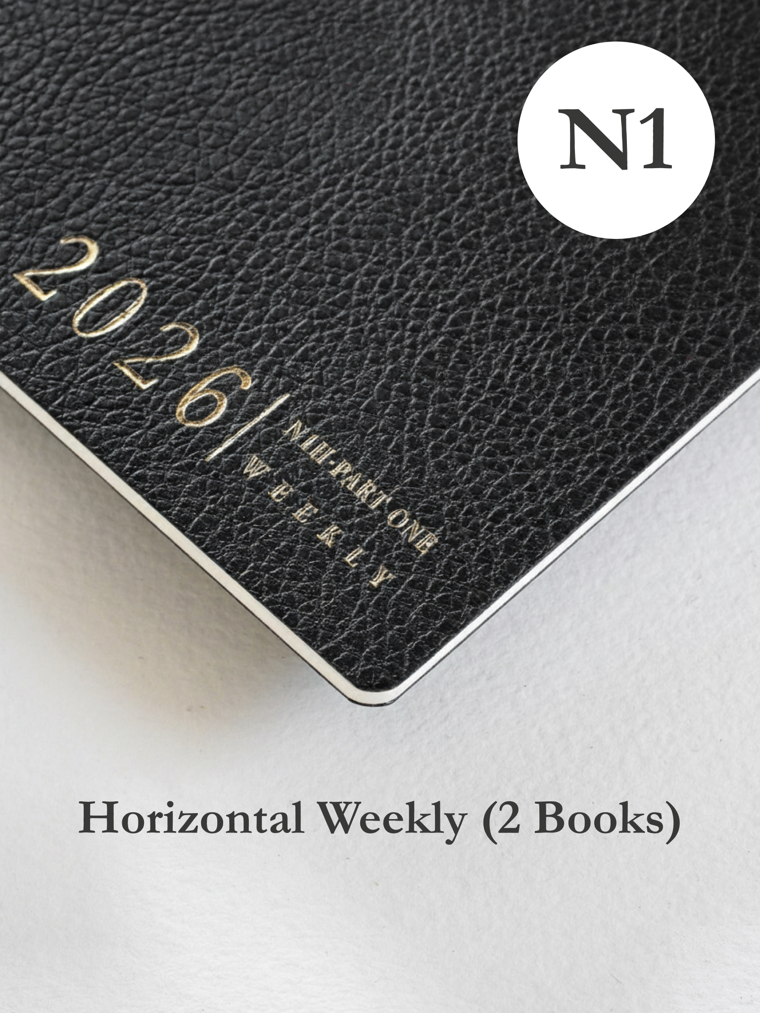 Sleek black faux leather planner cover for 2026, featuring minimalist embossed text that reads "N1 Horizontal Weekly."