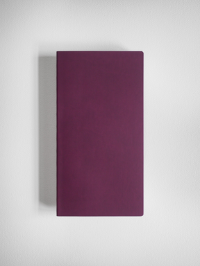 Solid, minimalist notebook with a uniform deep magenta cover, designed for grid writing and journaling.