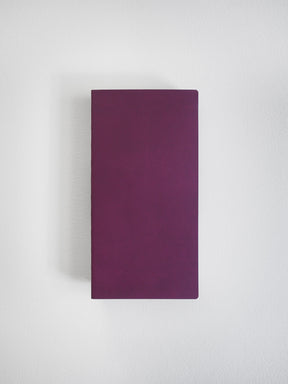 Solid, deep plum notebook with a plain, minimalist cover, perfect for journaling and structured note-taking.