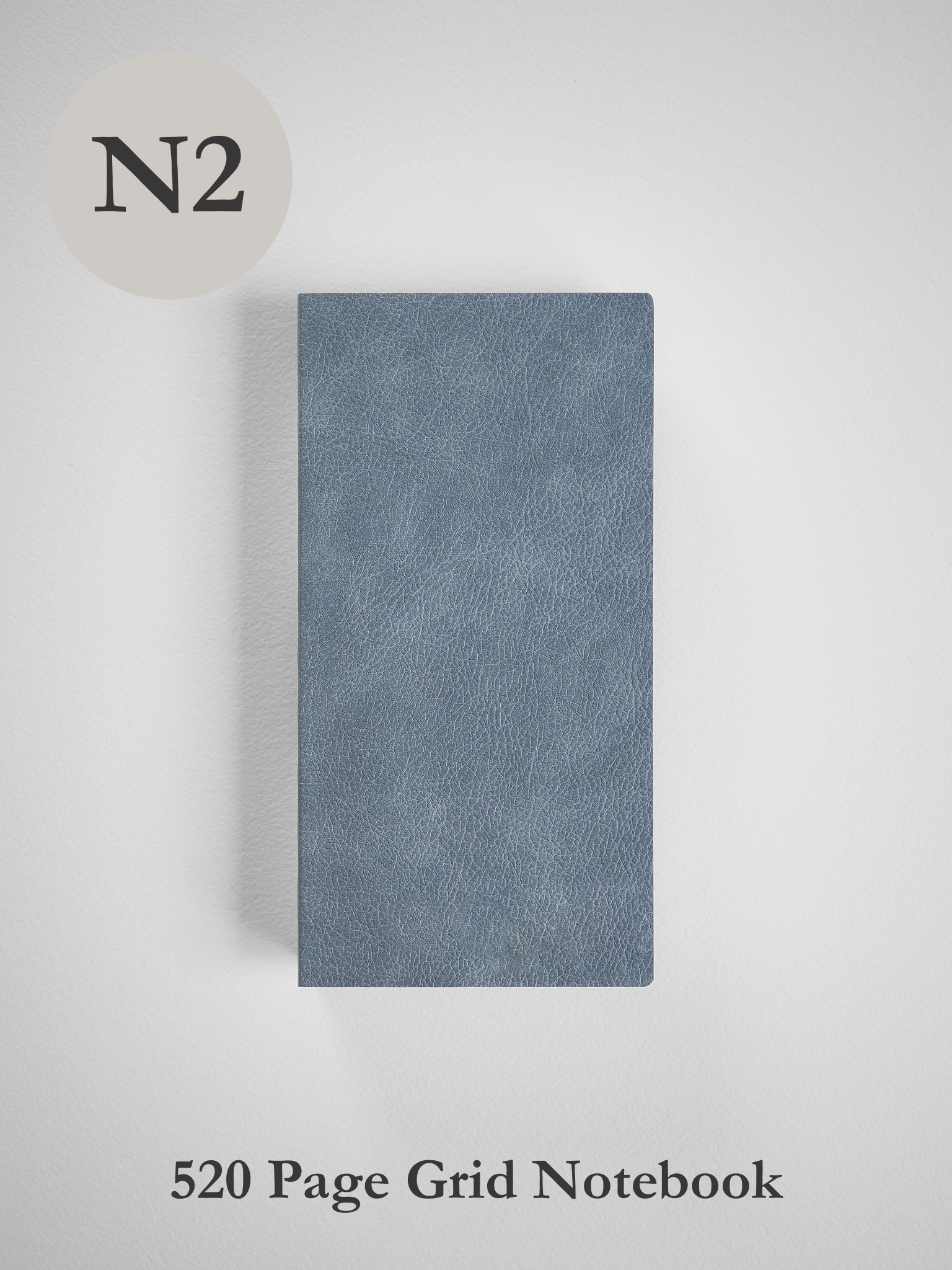 Sleek, solid slate-gray notebook featuring a subtly textured, minimalist cover ideal for 520 pages of grid note-taking.