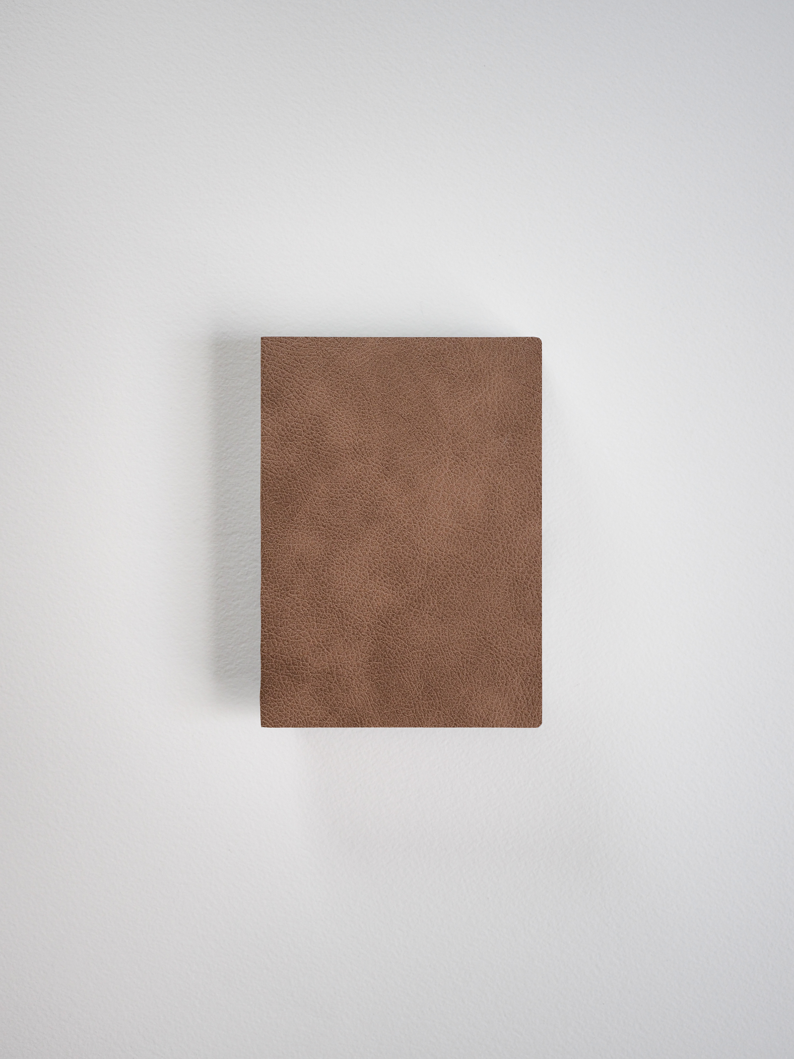 Solid, textured cognac brown notebook cover with a minimalist design, perfect for journaling or everyday note-taking.