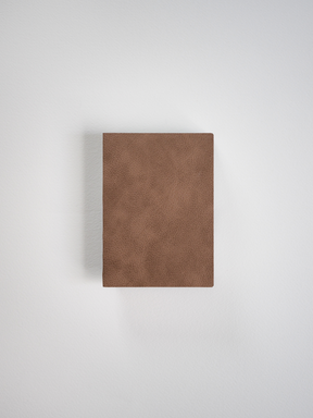 Solid, textured cognac brown notebook cover with a minimalist design, perfect for journaling or everyday note-taking.