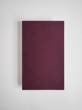 A solid A5 grid notebook featuring a rich, deep burgundy cover for writing, journaling, or planning with 272 pages.