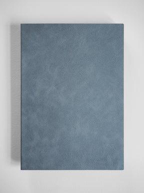 Minimalist B5 notebook featuring a richly textured, matte slate gray faux leather cover, ideal for professional journaling.