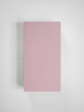 Solid rectangular grid notebook cover in a minimalist, solid pale pink hue.