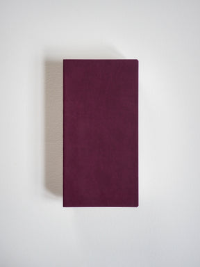 Solid deep burgundy notebook cover, displaying a clean, matte, unadorned rectangular surface perfect for writing.