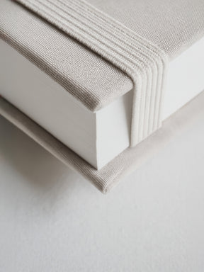 Elegant B6 undated diary featuring a light taupe, textured hardcover wrap with subtle vertical ribbing details for a minimalist and sophisticated planner.