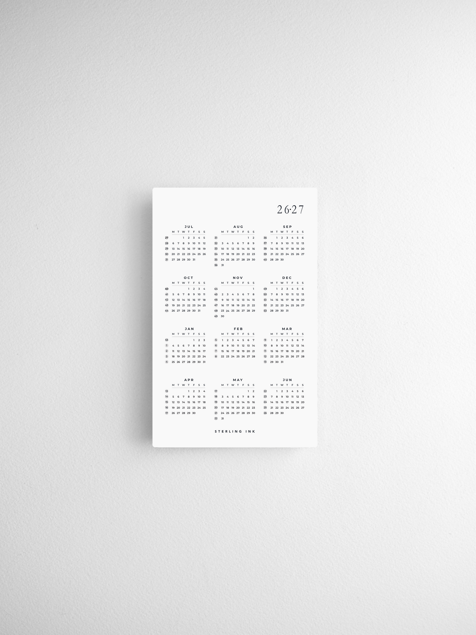 Pocket calendar cards displaying a minimalist black and white grid for year-at-a-glance planning across 2026 and 2027.