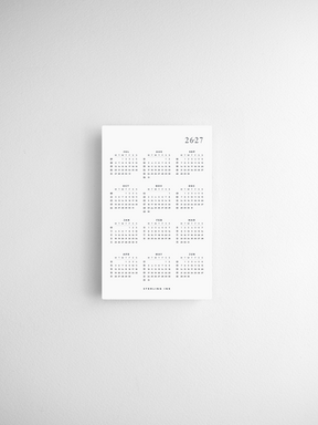 Pocket calendar cards displaying a minimalist black and white grid for year-at-a-glance planning across 2026 and 2027.