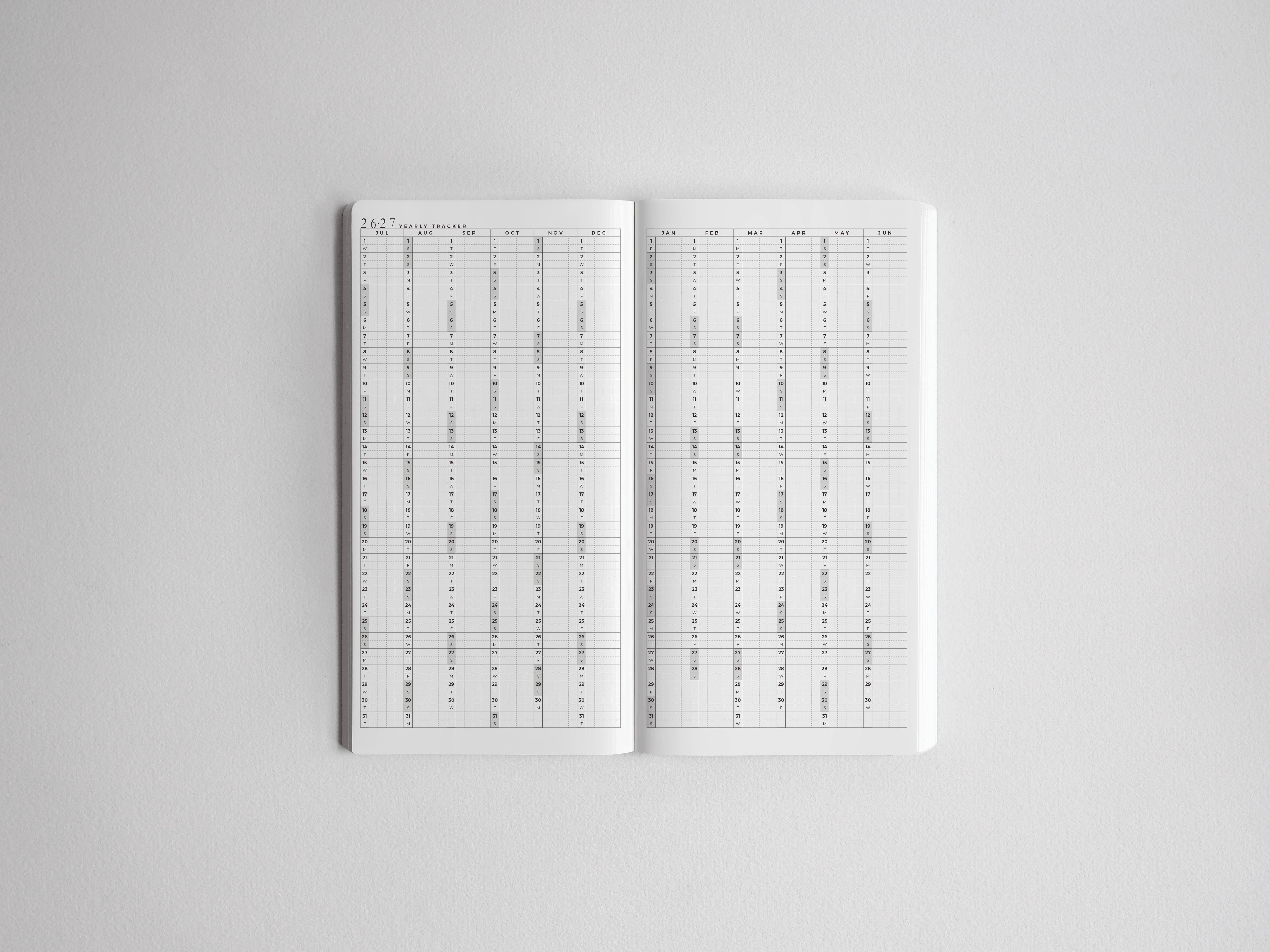 Open, full-year academic planner for 2026-2027, featuring a white, grid layout designed for detailed date tracking and semester planning.